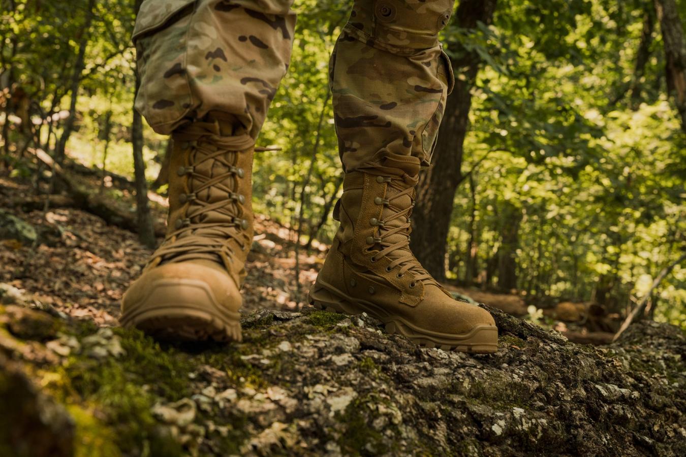 Soldier walking through forest in combat boots