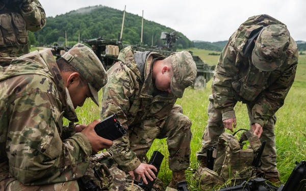 U.S. Army Soldiers packing plate carriers